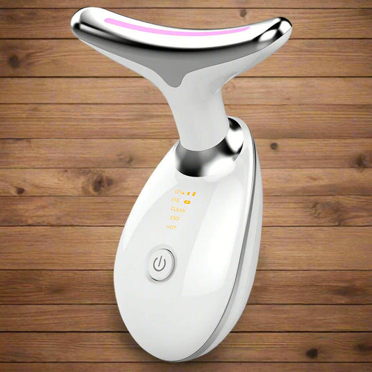 White and silver facial massager on a white background